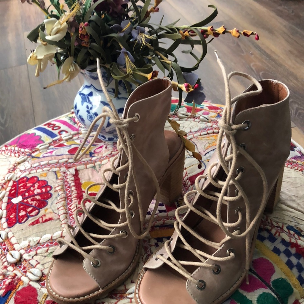 Light tan, heeled sandals. Toe and heel exposed. Soft leather, like new.